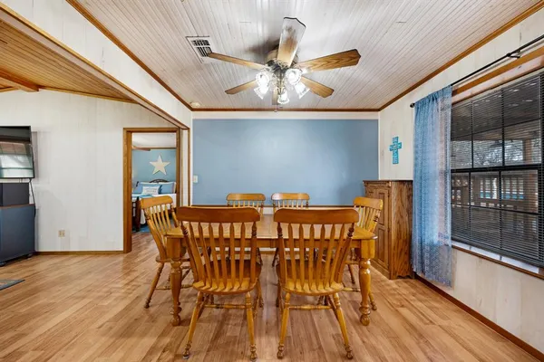 a view of a dining room with furniture and window