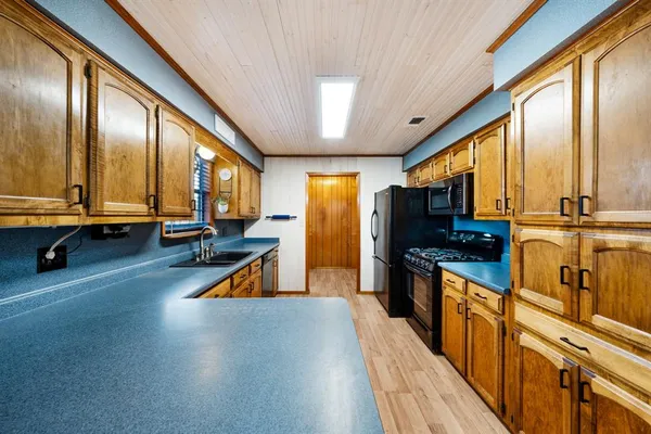 a view of a kitchen with a large window