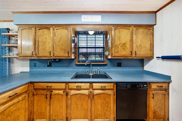 a view of a bathroom with shower and wooden floor
