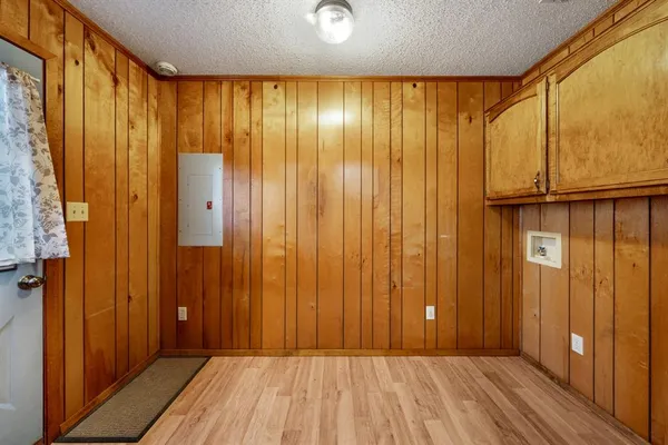 a bed room with a bed and a chandelier