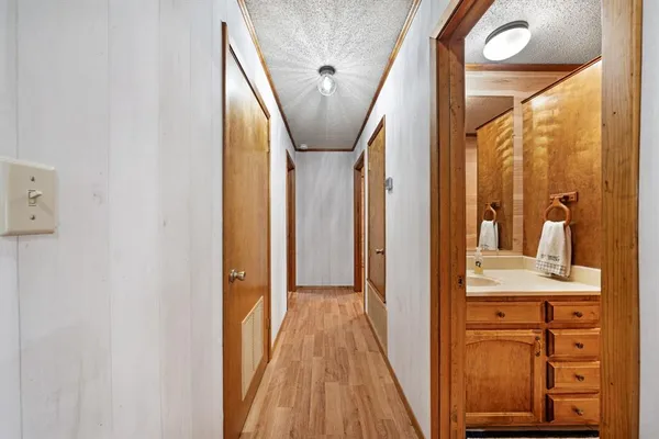 a bathroom with a granite countertop sink mirror bathtub and shower