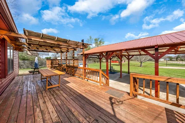 a view of a chairs and table in the patio