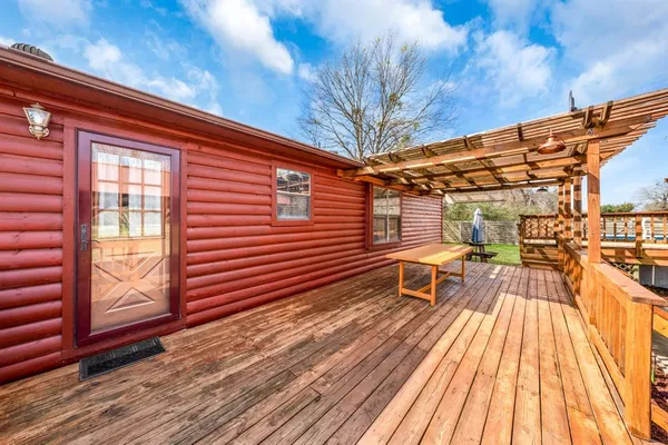a view of a room with wooden walls