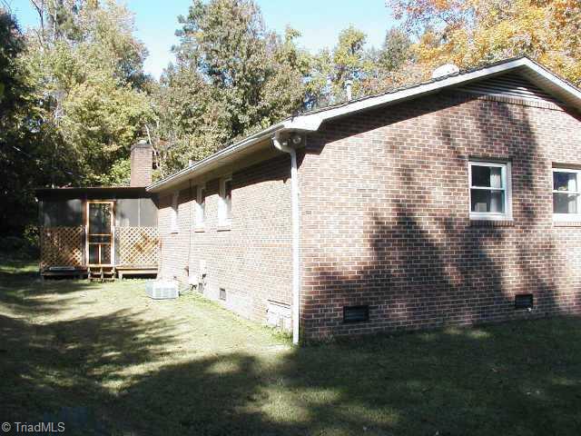 Other. Back view of the home. Home backs to woods. Lots of privacy. Propane gas furnace & A/C replaced 2002. Water Heater replaced 2003. Updated foundation vents. Lots of trees & woods all around.