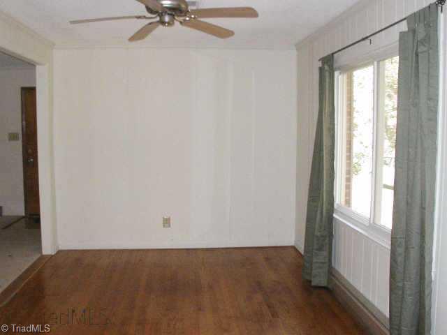 Other. Living Room could be used as a formal Dining Room.  Wood floors in Living Room, Hallway & all 3 Bedrooms. New window treatments in LR & BRs. LR open to adjacent Den & Kitchen.