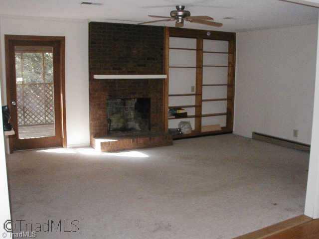 Other. Cozy den centered around a real masonry wood-burning fireplace. Built-in bookshelves. 5 new ceiling fans throughout the home. Door to the screened porch. Note there s no wallpaper in this home.