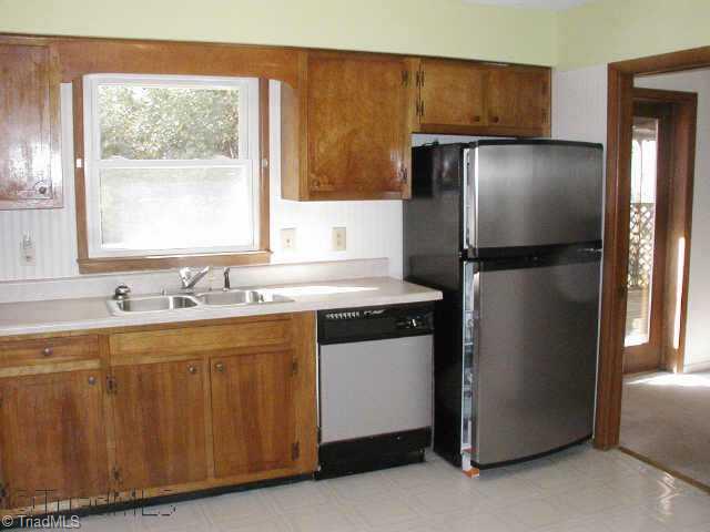 Other. Spacious Kitchen with lots of cabinets & a pantry. Appliances include new stainless refrigerator, dishwasher, cooktop & oven. Brand new countertops just installed. Window over the sink offers views of the backyard & adjacent woods.