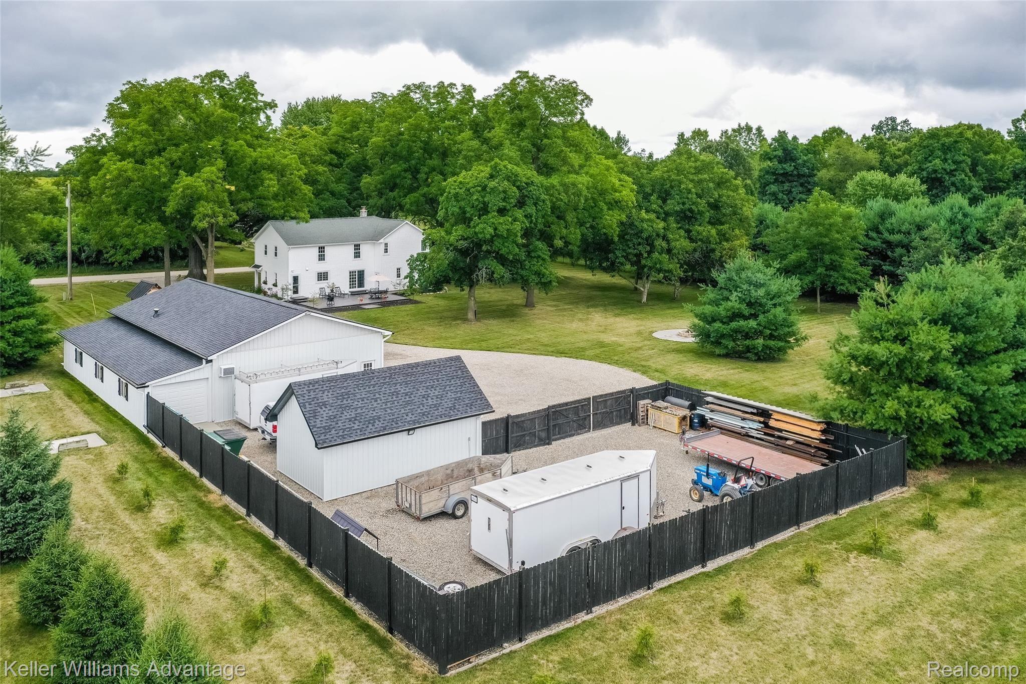 5385 Mack Road Howell, MI 48855 - Photo 3 of 59 Fully updated, move-in-ready. 2-acres with 60x40 pole barn with 10x60 full-length addition. Pole barn has office, new roof, new roof, heat, air, and water. Additional detached garage, and fenced area for large equipment storage.
