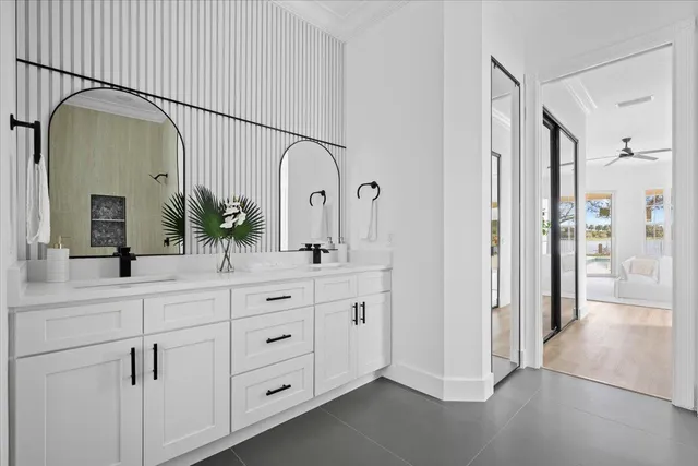 a bathroom with a bathtub and next to a window