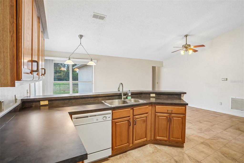 2596 Alclobe Circle Ocoee, FL 34761 - Photo 21 of 70 a kitchen with a sink and cabinets