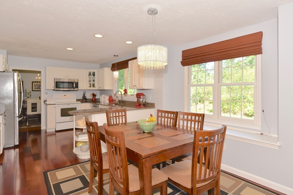 283 Potter Road Framingham, MA 01701 - Photo 12 of 29 a view of a dining room with furniture window and wooden floor