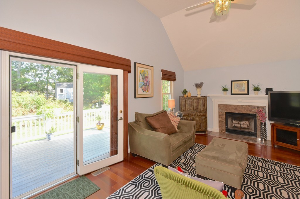 283 Potter Road Framingham, MA 01701 - Photo 15 of 29 a living room with furniture and a fireplace
