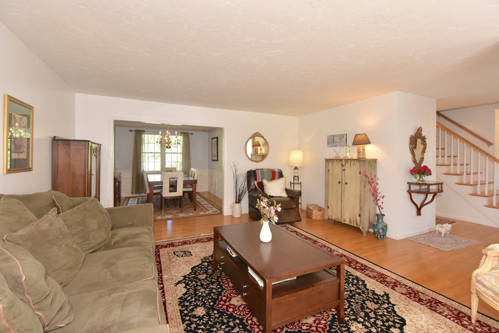 283 Potter Road Framingham, MA 01701 - Photo 16 of 29 a living room with furniture a flat screen tv and a table