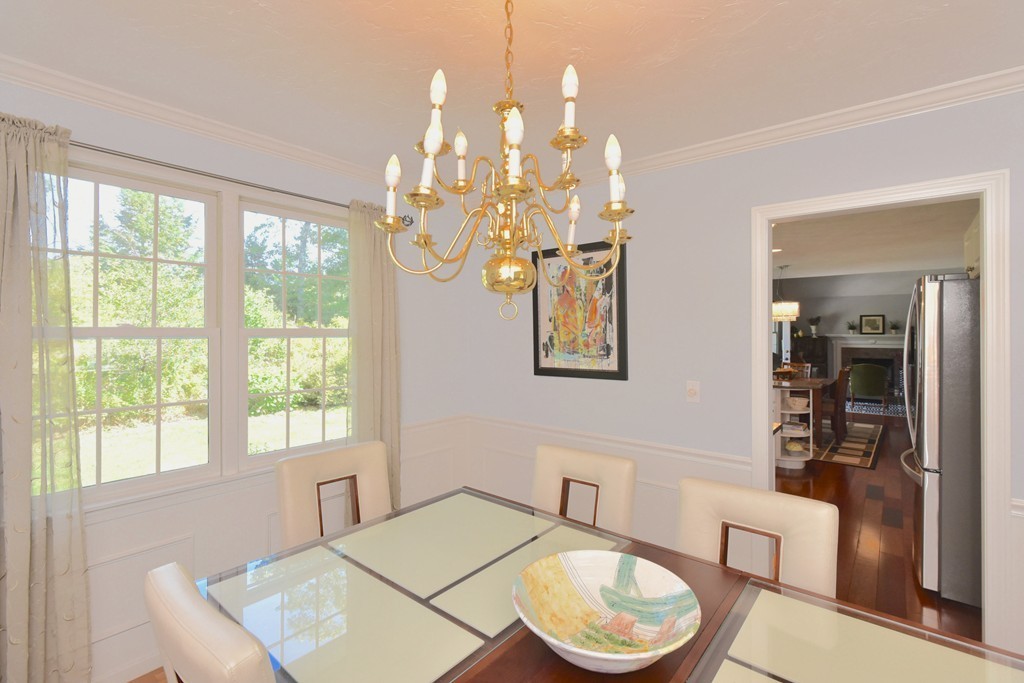 283 Potter Road Framingham, MA 01701 - Photo 20 of 29 a living room with furniture and a chandelier