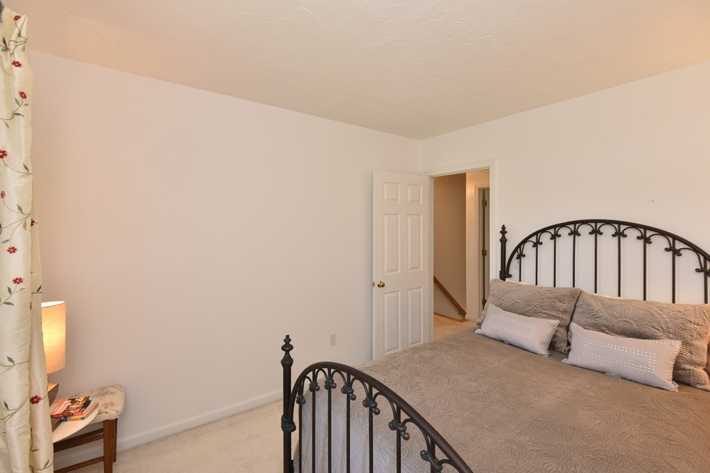 283 Potter Road Framingham, MA 01701 - Photo 27 of 29 a bedroom with a bed and a window