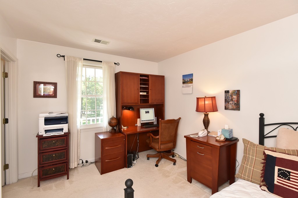 283 Potter Road Framingham, MA 01701 - Photo 28 of 29 a view of a workspace with furniture and a window