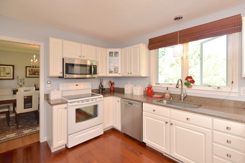 283 Potter Road Framingham, MA 01701 - Photo 8 of 29 a kitchen with appliances a sink and a window