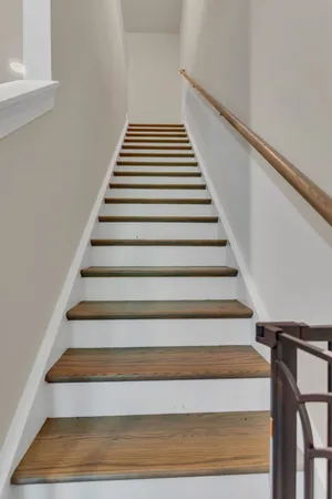 an empty room with fireplace and painted walls