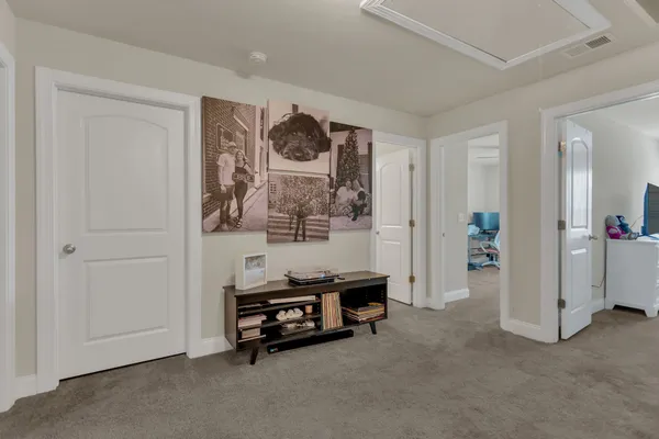 a bedroom with a bed and cabinets