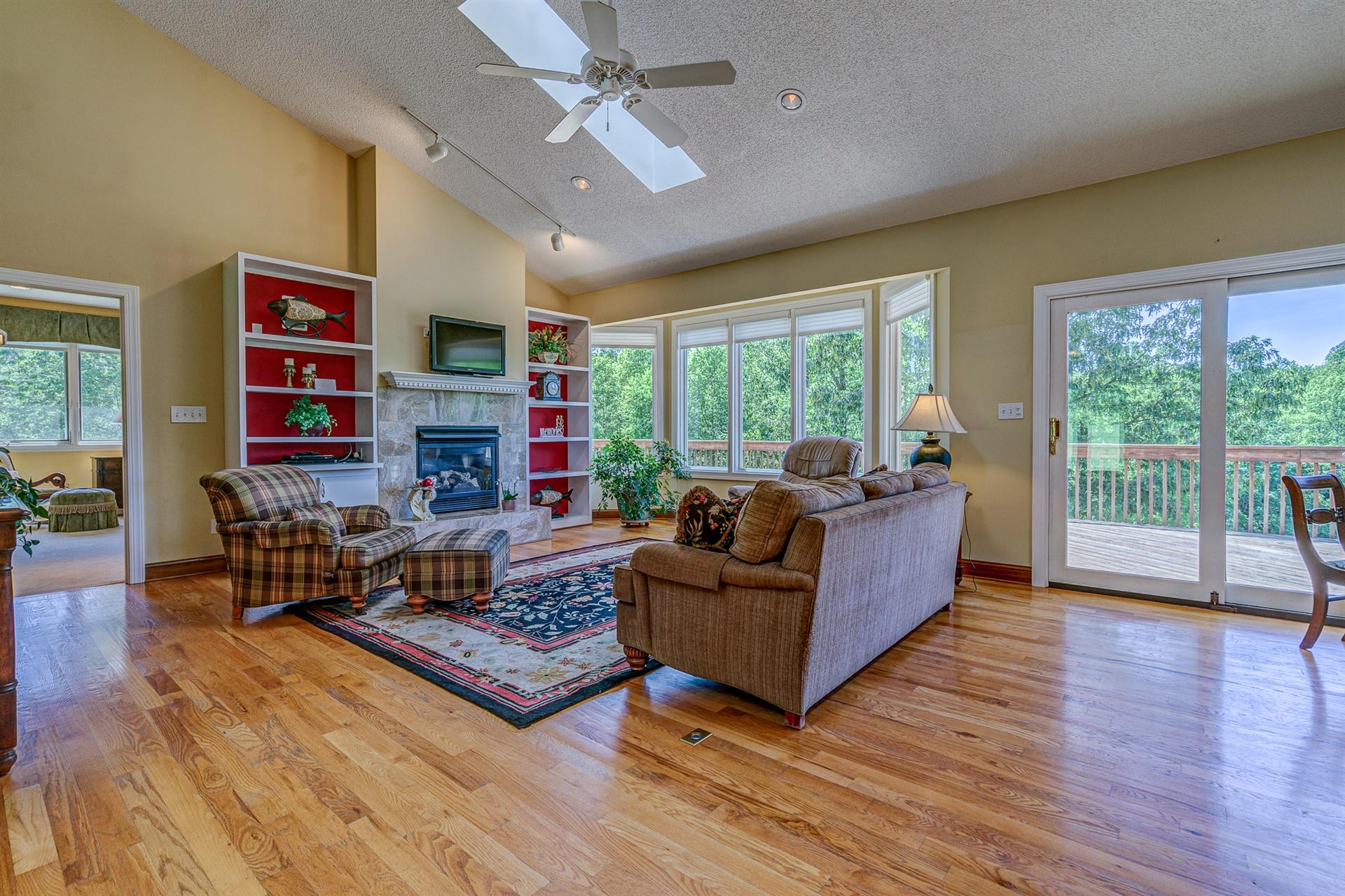 1899 Retreat Road Boones Mill, VA 24065 - Photo 6 of 76 a living room with furniture large window and wooden floor