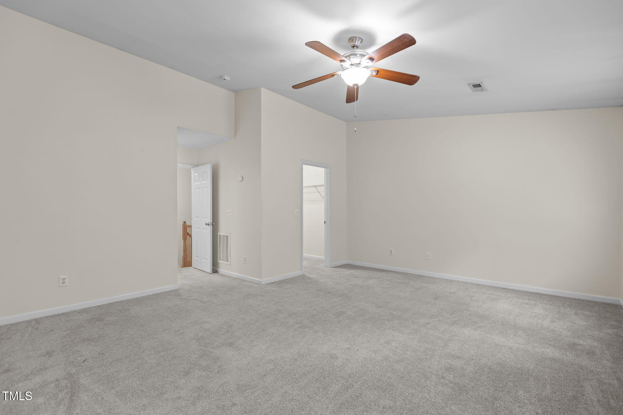 11720 Mezzanine Drive, Unit 103 Raleigh, NC 27614 - Photo 11 of 18 an empty room with chandelier fan