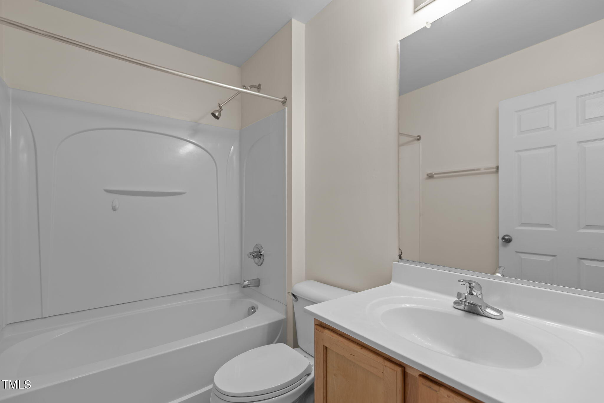11720 Mezzanine Drive, Unit 103 Raleigh, NC 27614 - Photo 16 of 18 a bathroom with a sink toilet and shower