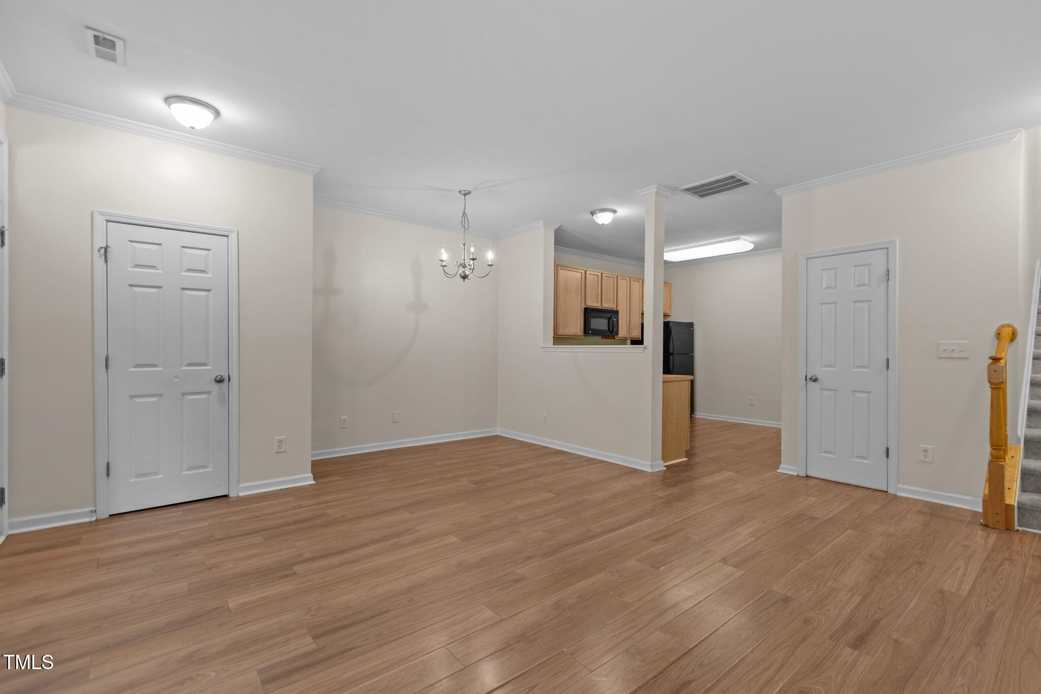 11720 Mezzanine Drive, Unit 103 Raleigh, NC 27614 - Photo 4 of 18 a view of empty room with wooden floor