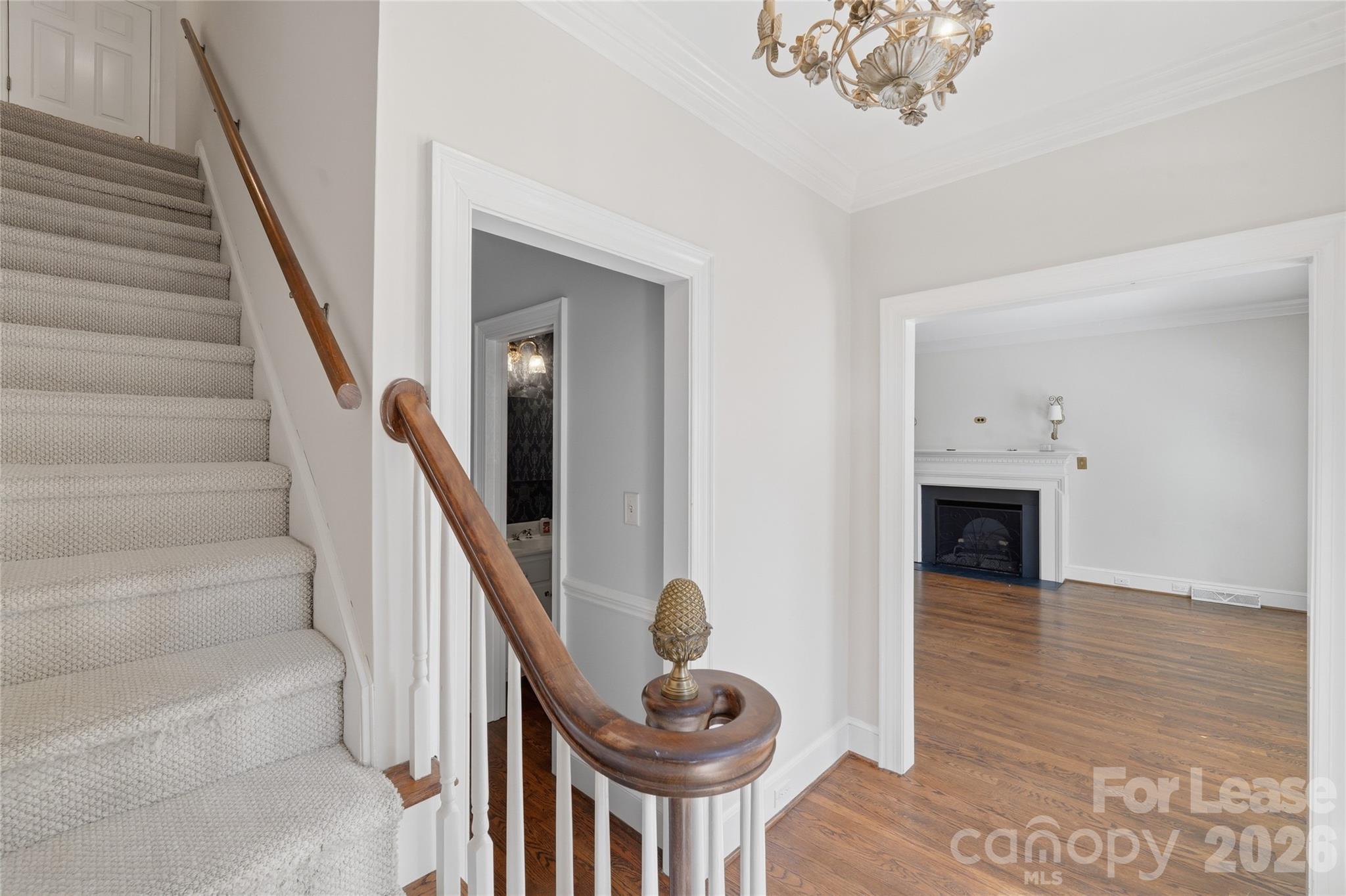 5906 Sharon Hills Road Charlotte, NC 28210 - Photo 7 of 30 a view of entryway and hall with wooden floor