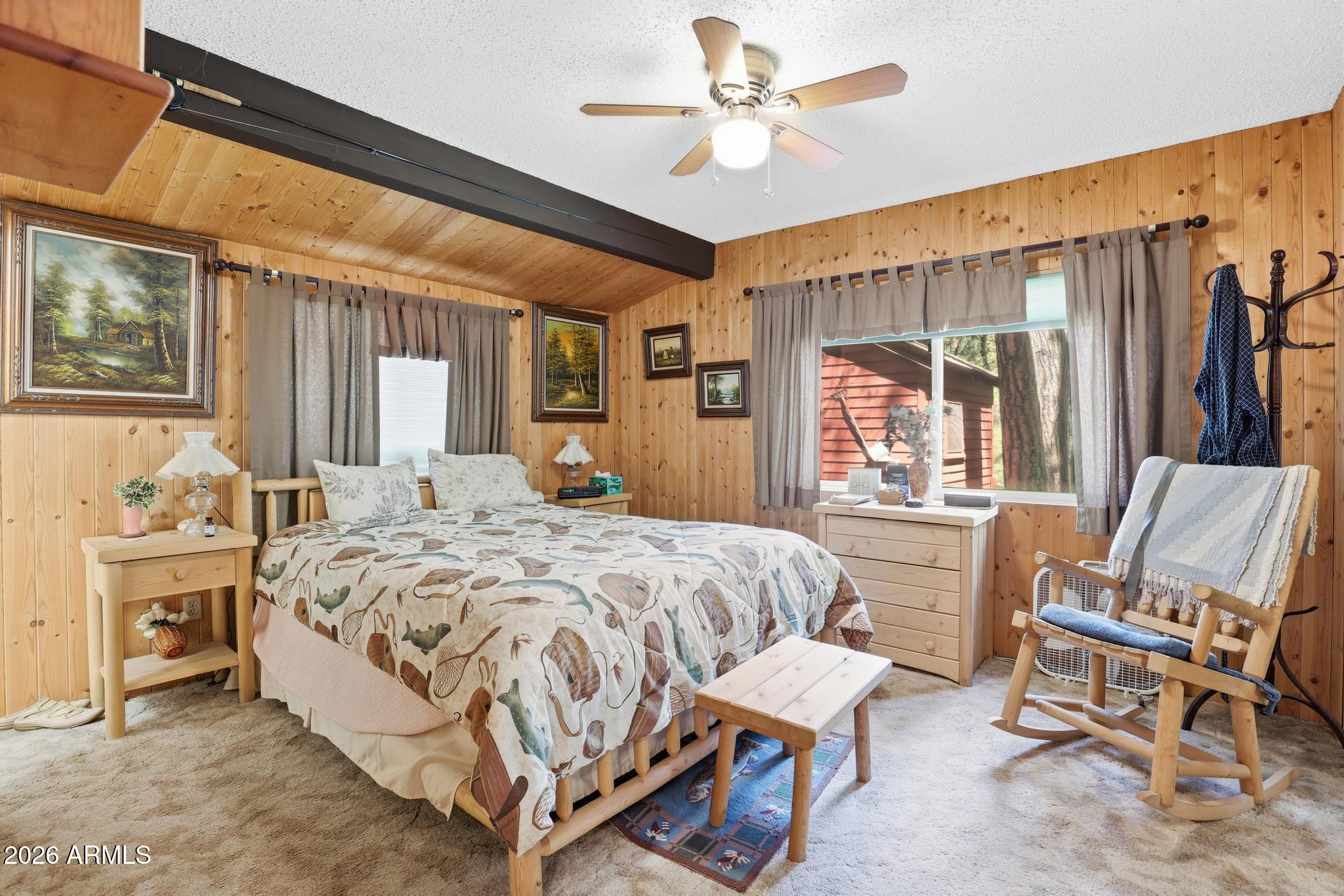 250 East Saddle Mountain Road Payson, AZ 85541 - Photo 13 of 32 a bed sitting in a spacious bedroom next to a window