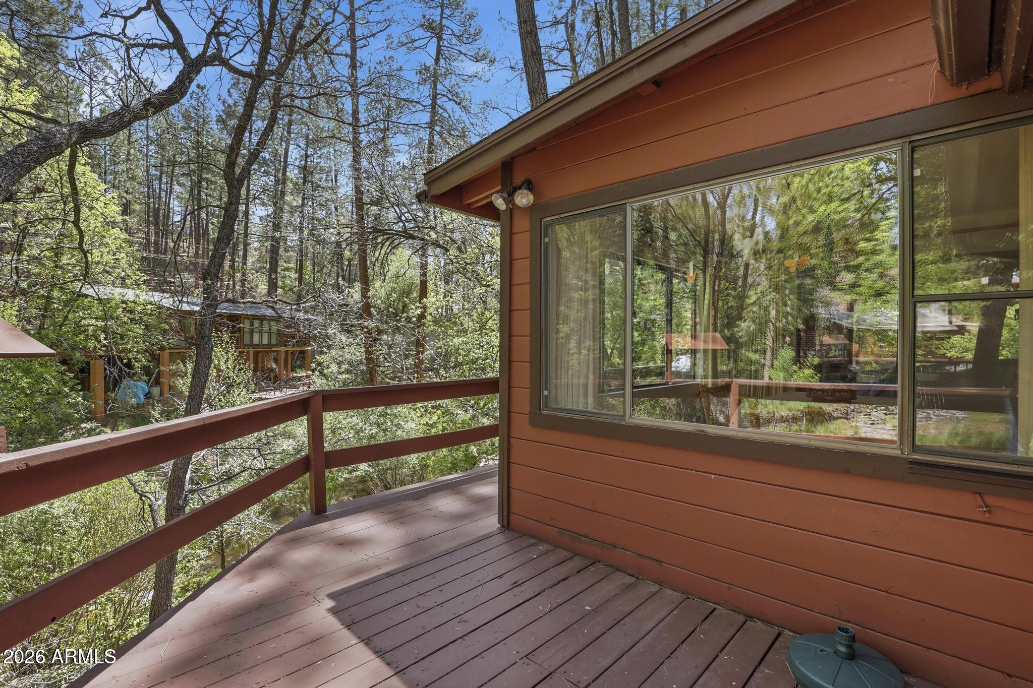 250 East Saddle Mountain Road Payson, AZ 85541 - Photo 21 of 32 a view of a wooden deck and a yard