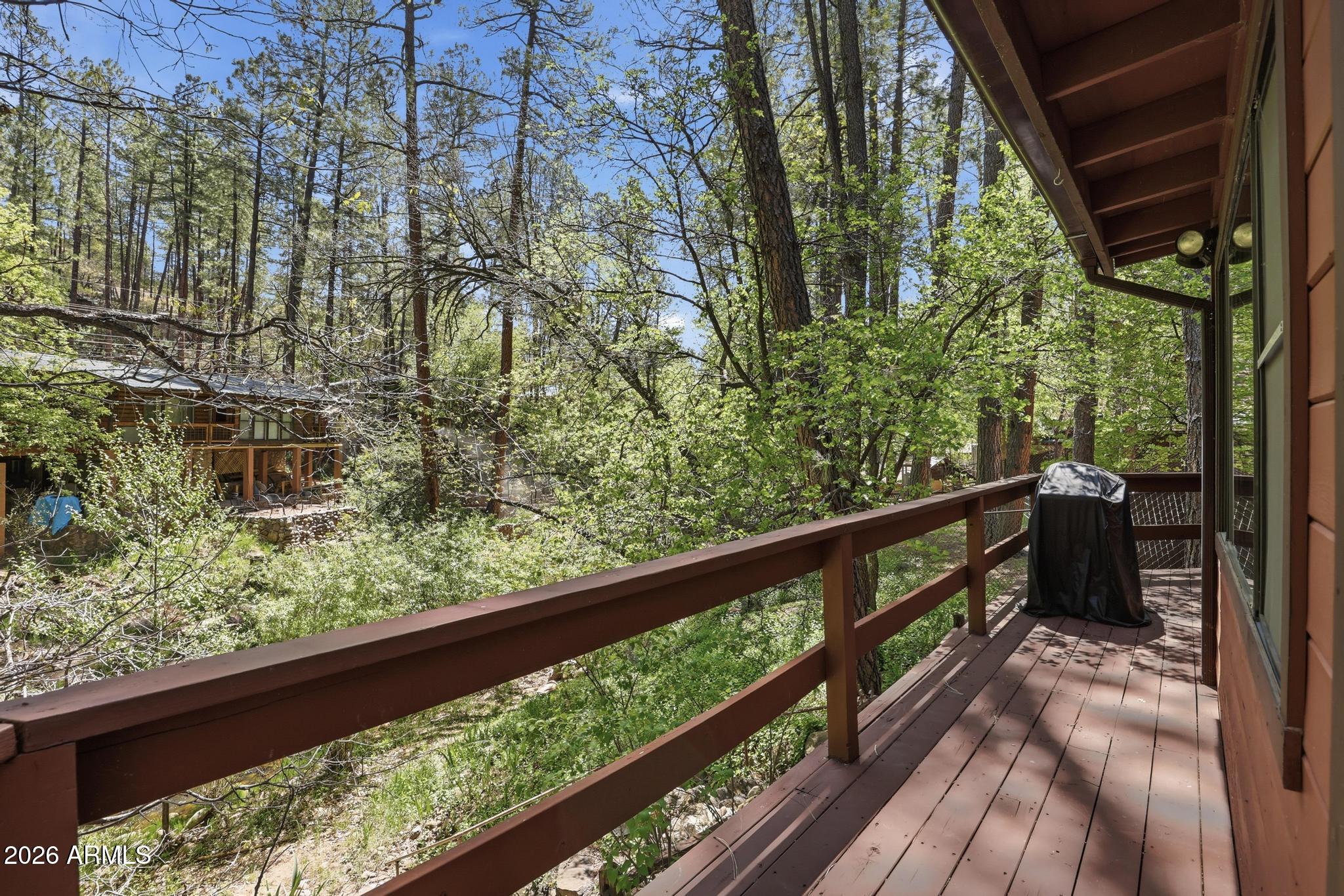 250 East Saddle Mountain Road Payson, AZ 85541 - Photo 23 of 32 a view of a balcony with wooden fence and floor