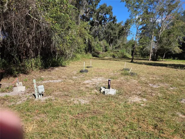 a view of a backyard of the house