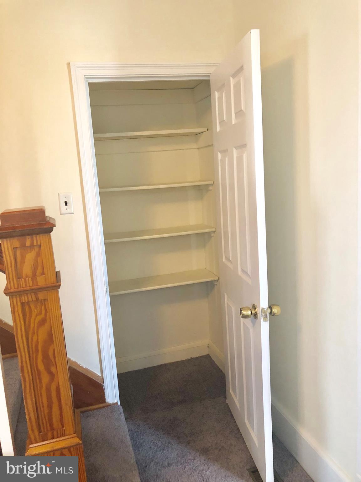 2703 West Woodwell Road Baltimore, MD 21222 - Photo 27 of 67 CLOSET AT BOTTOM OF STAIRS FOR ADDITIONAL STORAGE