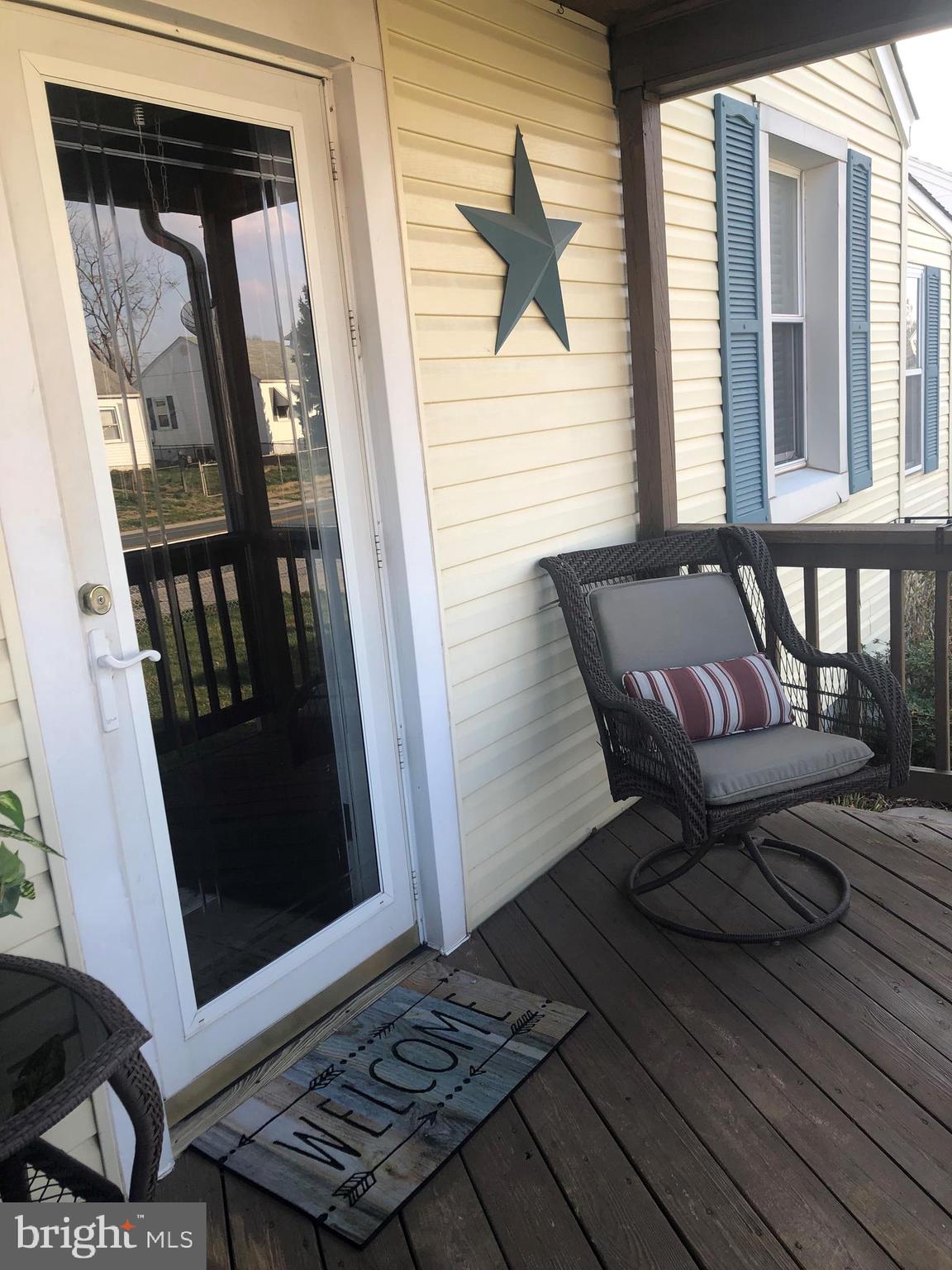 2703 West Woodwell Road Baltimore, MD 21222 - Photo 5 of 67 COVERED FRONT DECK TO SIT AND RELAX