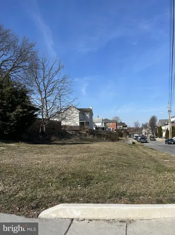 a view of a town with large trees