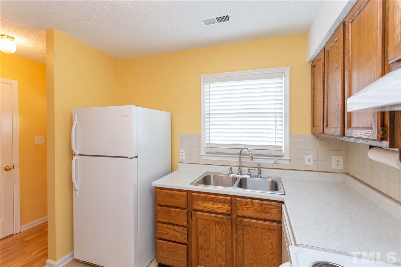 3314 Comstock Road Raleigh, NC 27604 - Photo 3 of 28 a white refrigerator freezer sitting in a kitchen