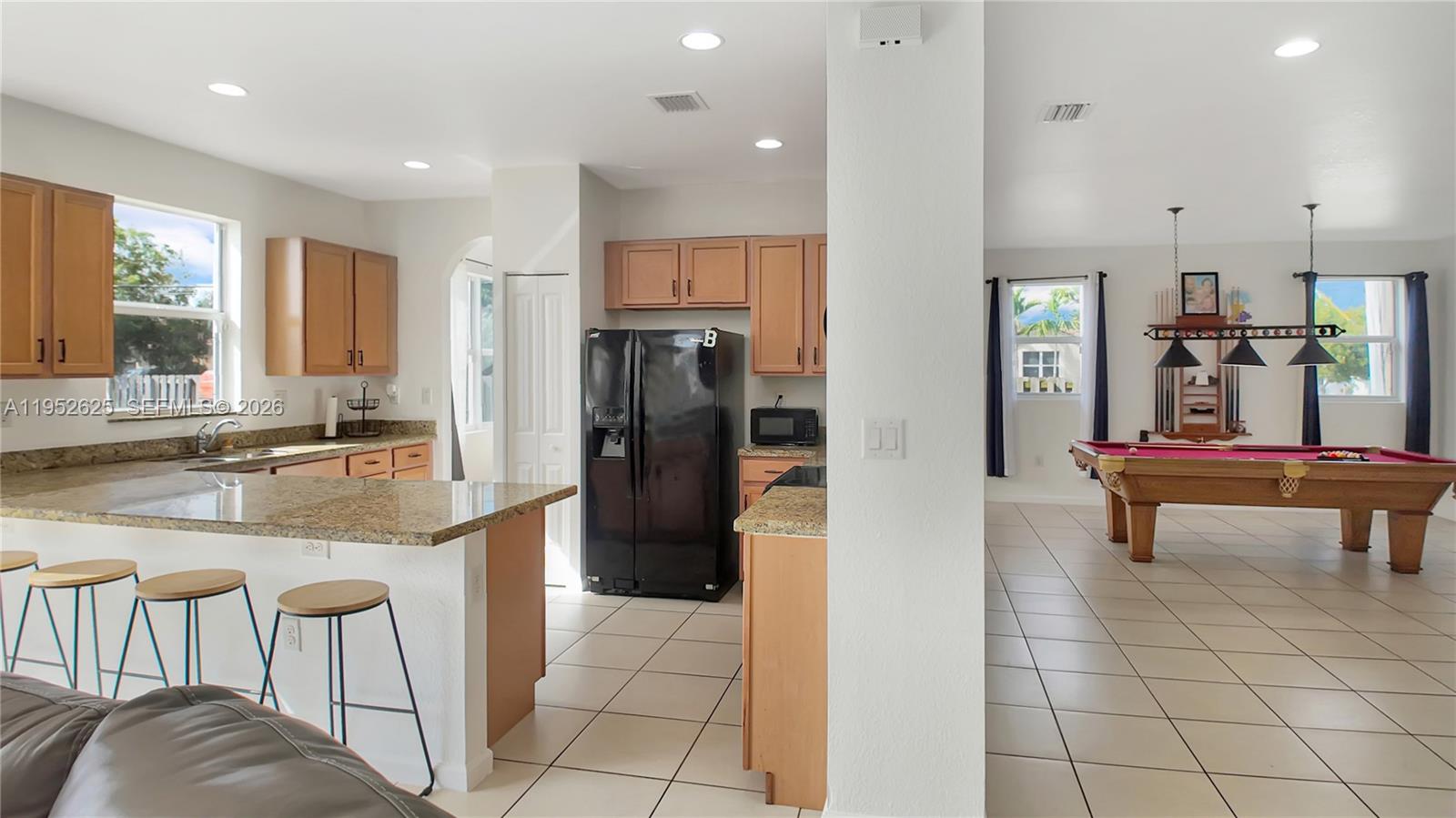 13160 Southwest 280th Street Homestead, FL 33033 - Photo 11 of 44 a kitchen with stainless steel appliances granite countertop a refrigerator and a sink