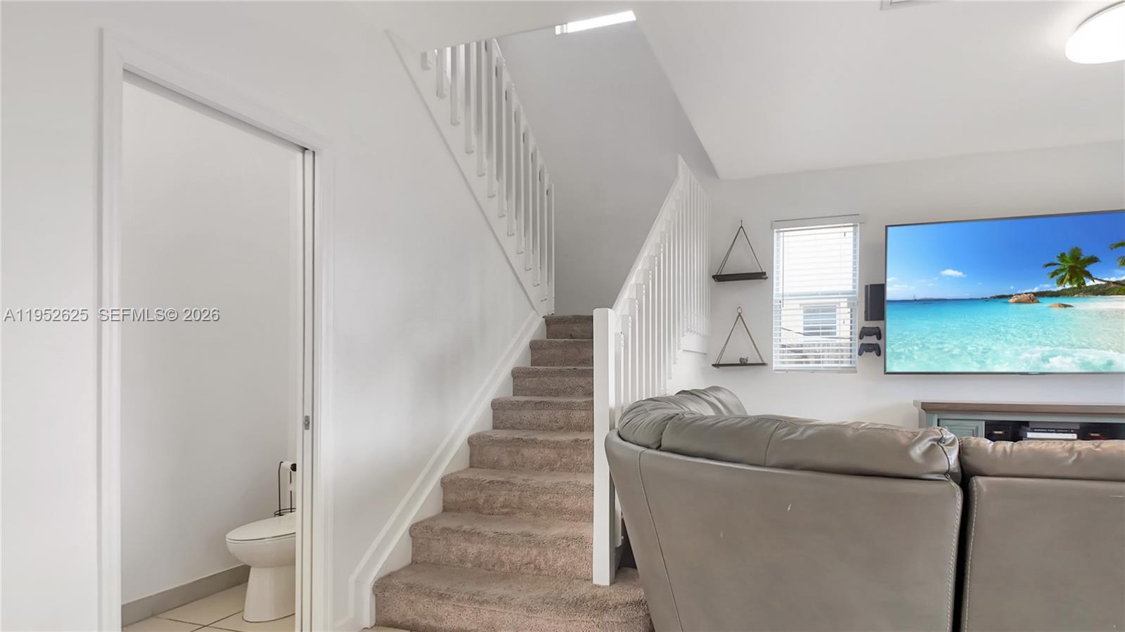13160 Southwest 280th Street Homestead, FL 33033 - Photo 18 of 44 a living room with furniture and a fireplace