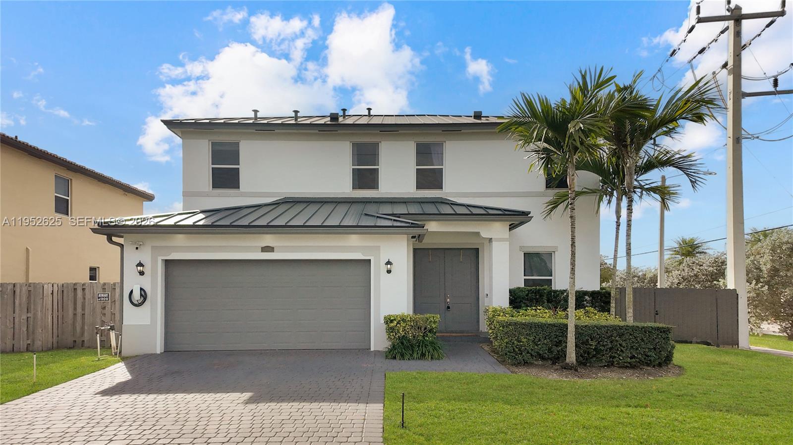 13160 Southwest 280th Street Homestead, FL 33033 - Photo 2 of 44 a view of a white house with a sink and garden