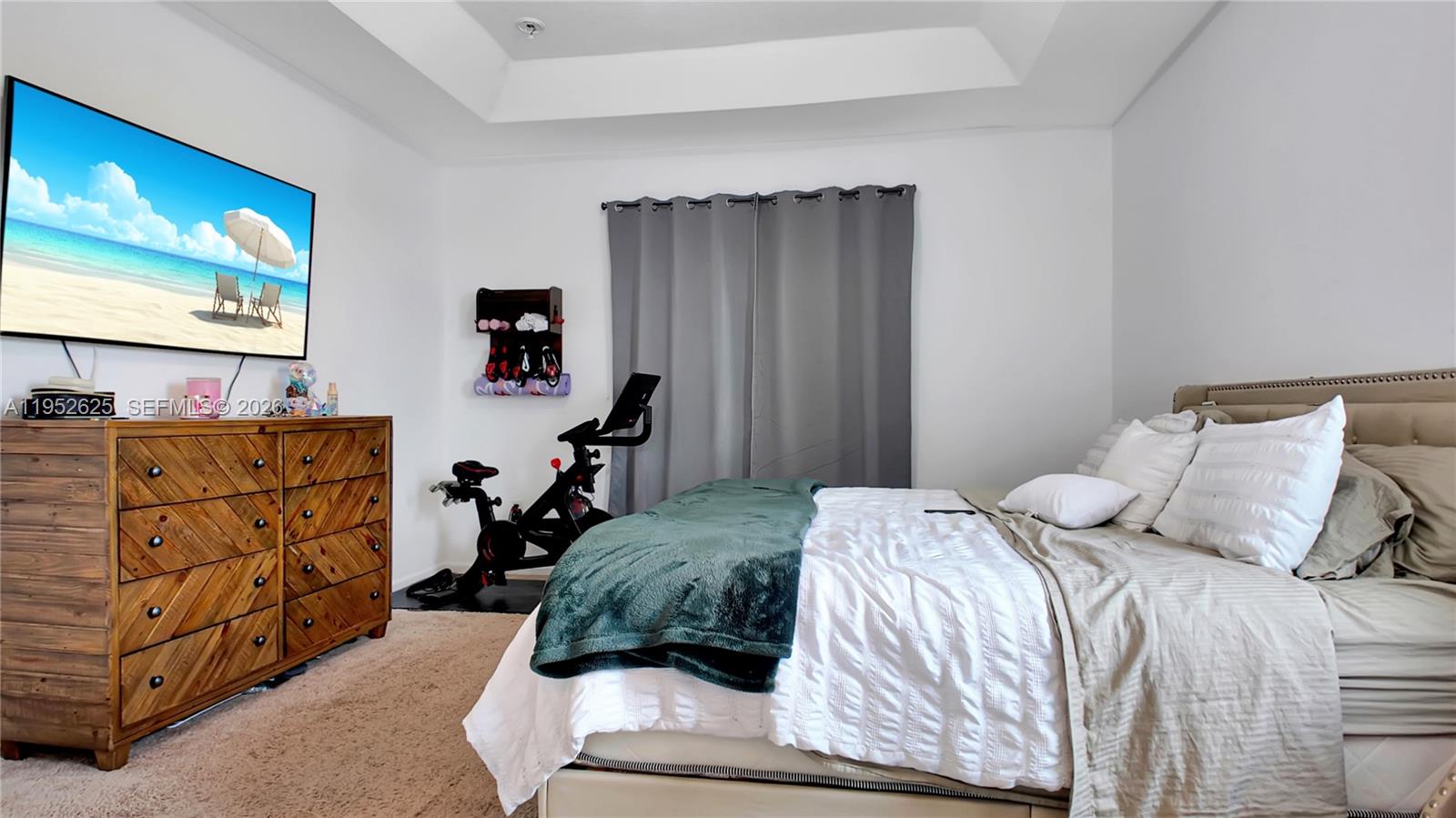 13160 Southwest 280th Street Homestead, FL 33033 - Photo 21 of 44 a bedroom with a bed window and a flat screen tv