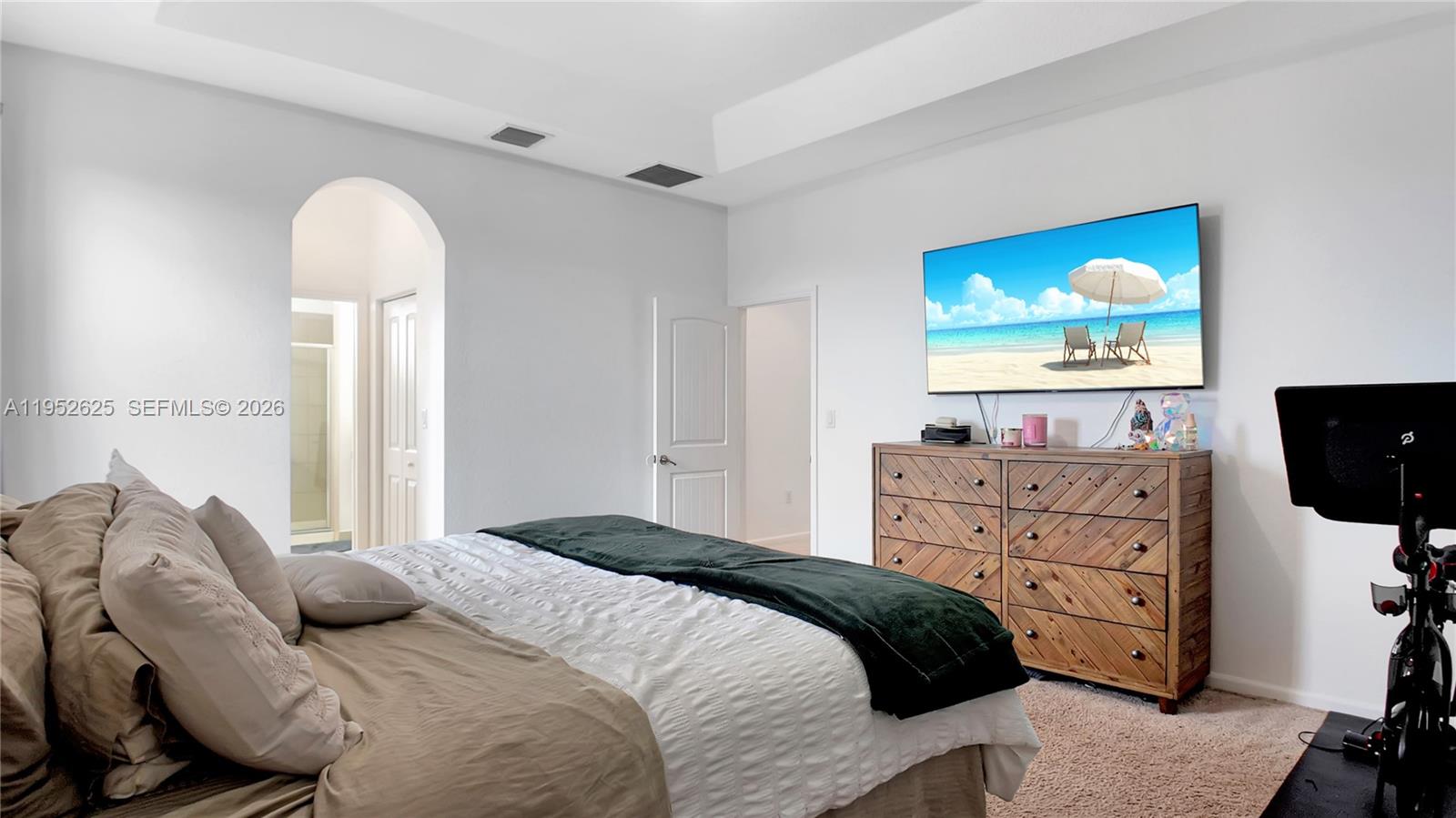 13160 Southwest 280th Street Homestead, FL 33033 - Photo 22 of 44 a bedroom with a bed and a flat screen tv