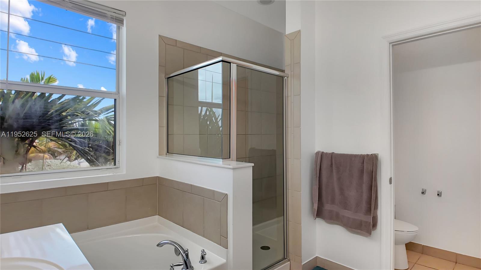 13160 Southwest 280th Street Homestead, FL 33033 - Photo 27 of 44 a bathroom with a tub and shower