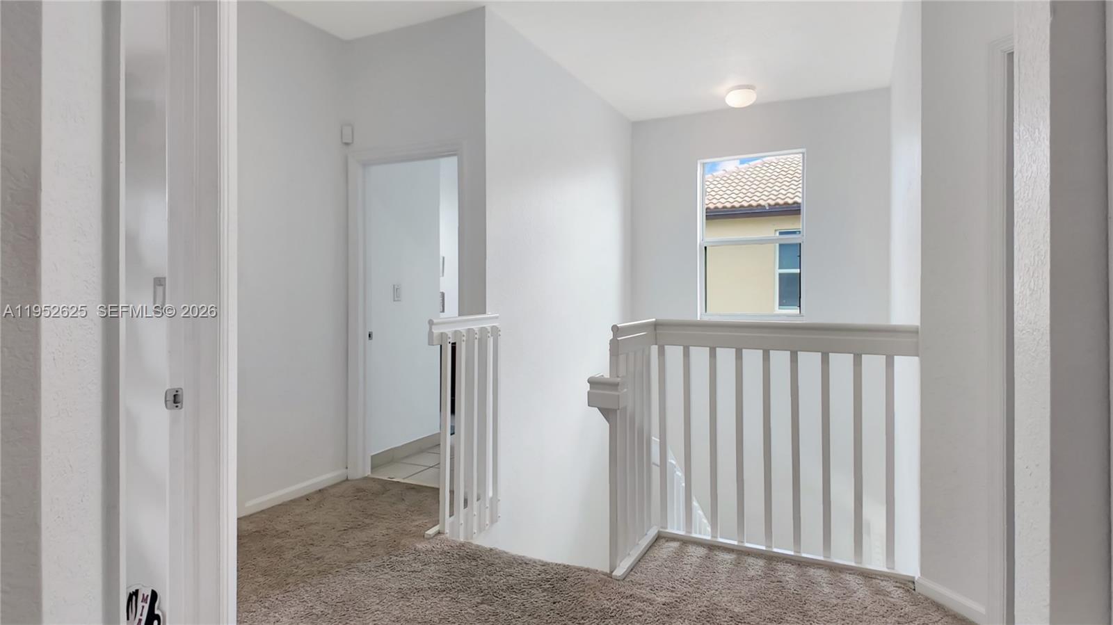 13160 Southwest 280th Street Homestead, FL 33033 - Photo 28 of 44 a view of a hallway with a livingroom and a bathroom