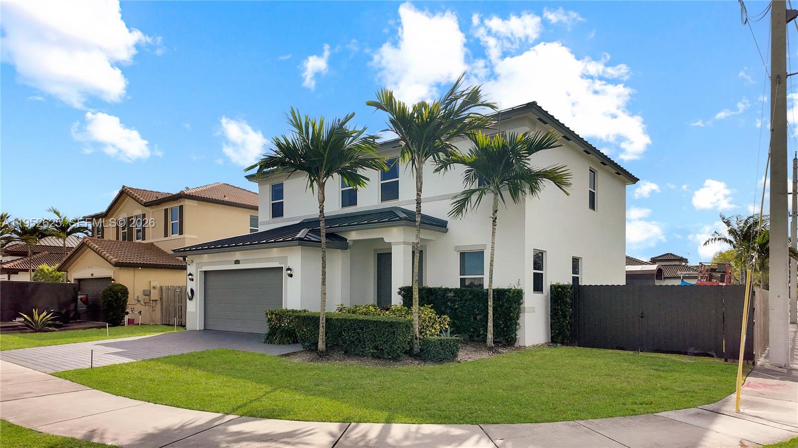 13160 Southwest 280th Street Homestead, FL 33033 - Photo 3 of 44 a front view of a house with a garden and entryway