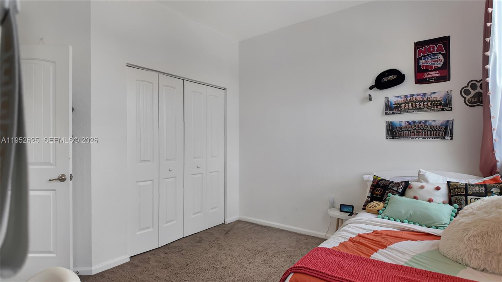 13160 Southwest 280th Street Homestead, FL 33033 - Photo 35 of 44 a bedroom with a bed and cabinets