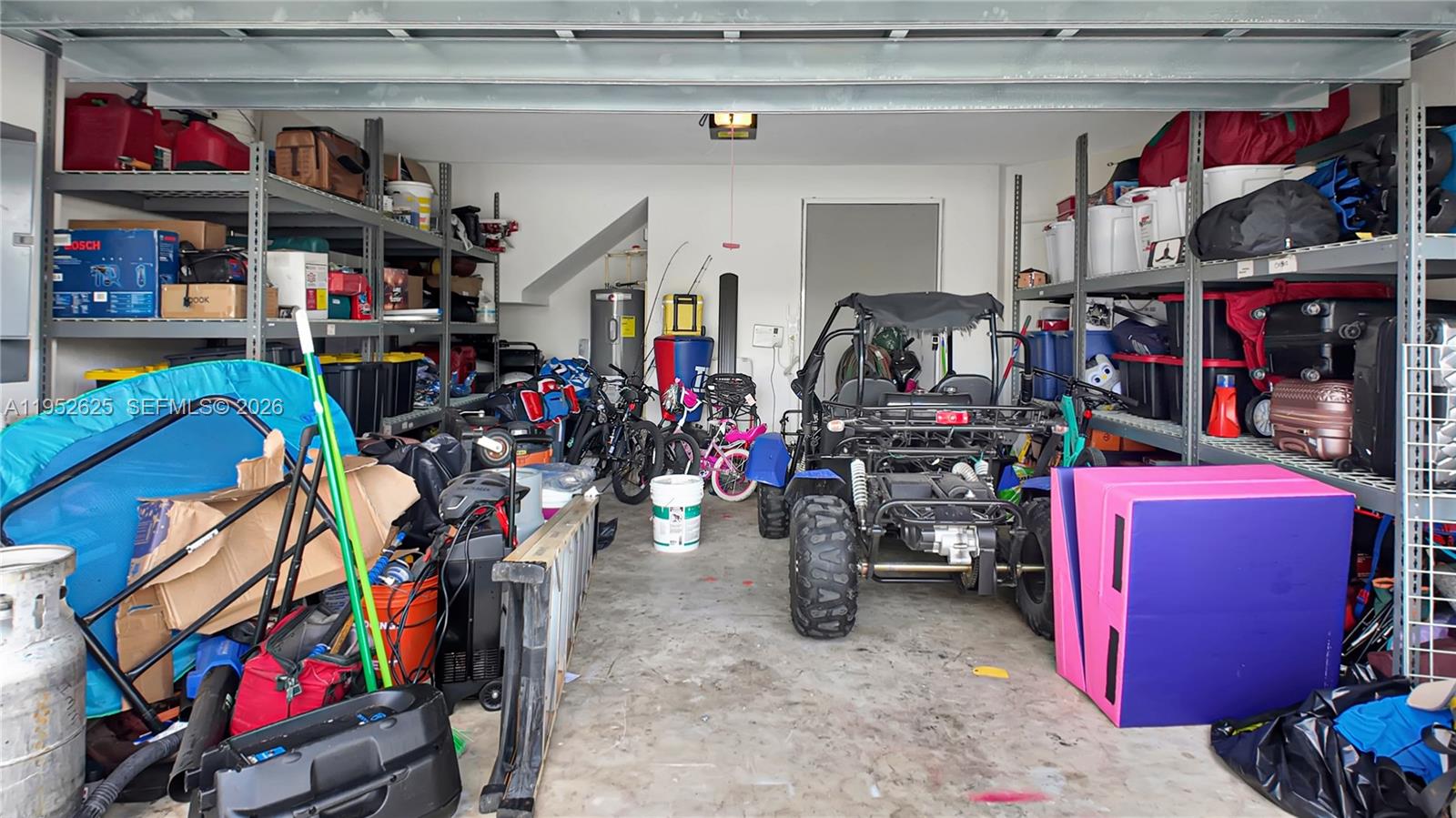 13160 Southwest 280th Street Homestead, FL 33033 - Photo 39 of 44 a view of a storage area with a lot of stuff