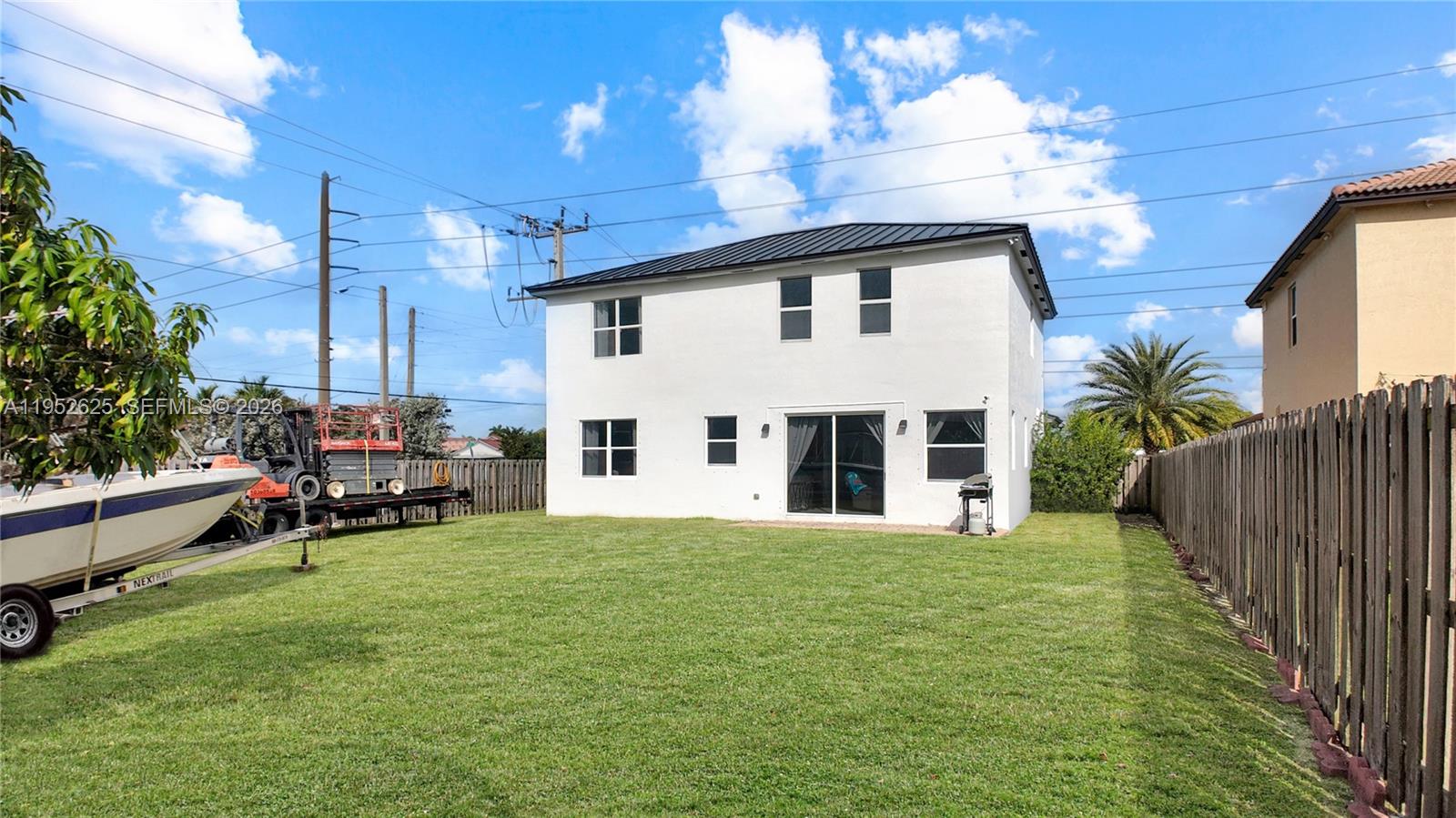 13160 Southwest 280th Street Homestead, FL 33033 - Photo 42 of 44 a view of a house with a yard and sitting area