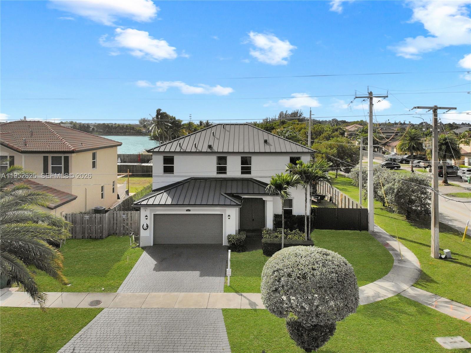 13160 Southwest 280th Street Homestead, FL 33033 - Photo 44 of 44 a front view of a house with a yard
