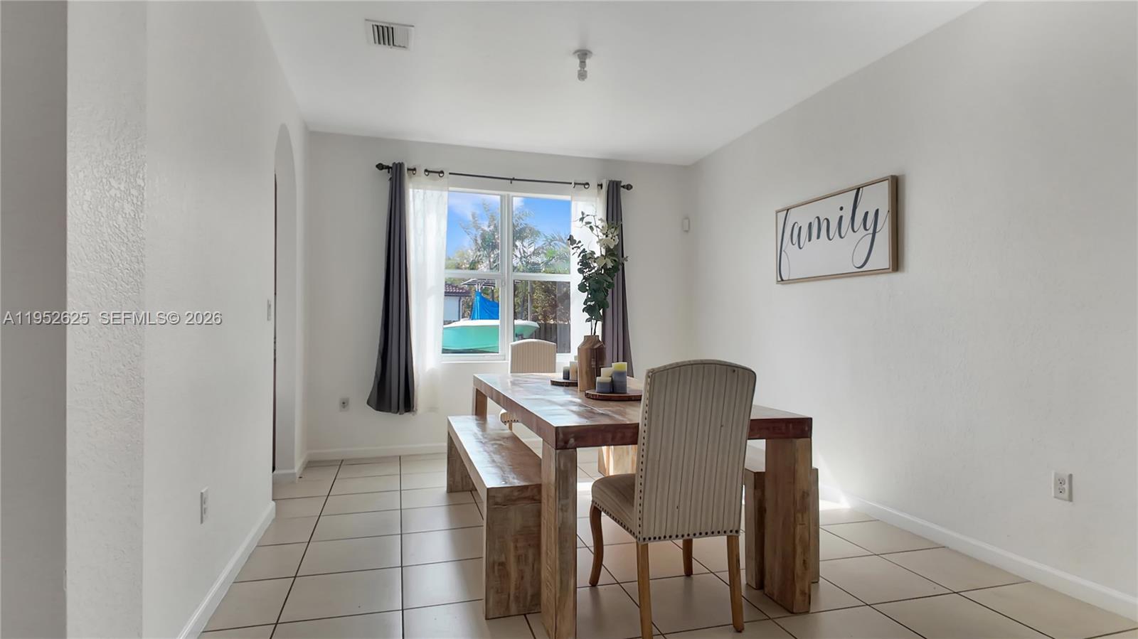 13160 Southwest 280th Street Homestead, FL 33033 - Photo 7 of 44 a view of a workspace with furniture and a window