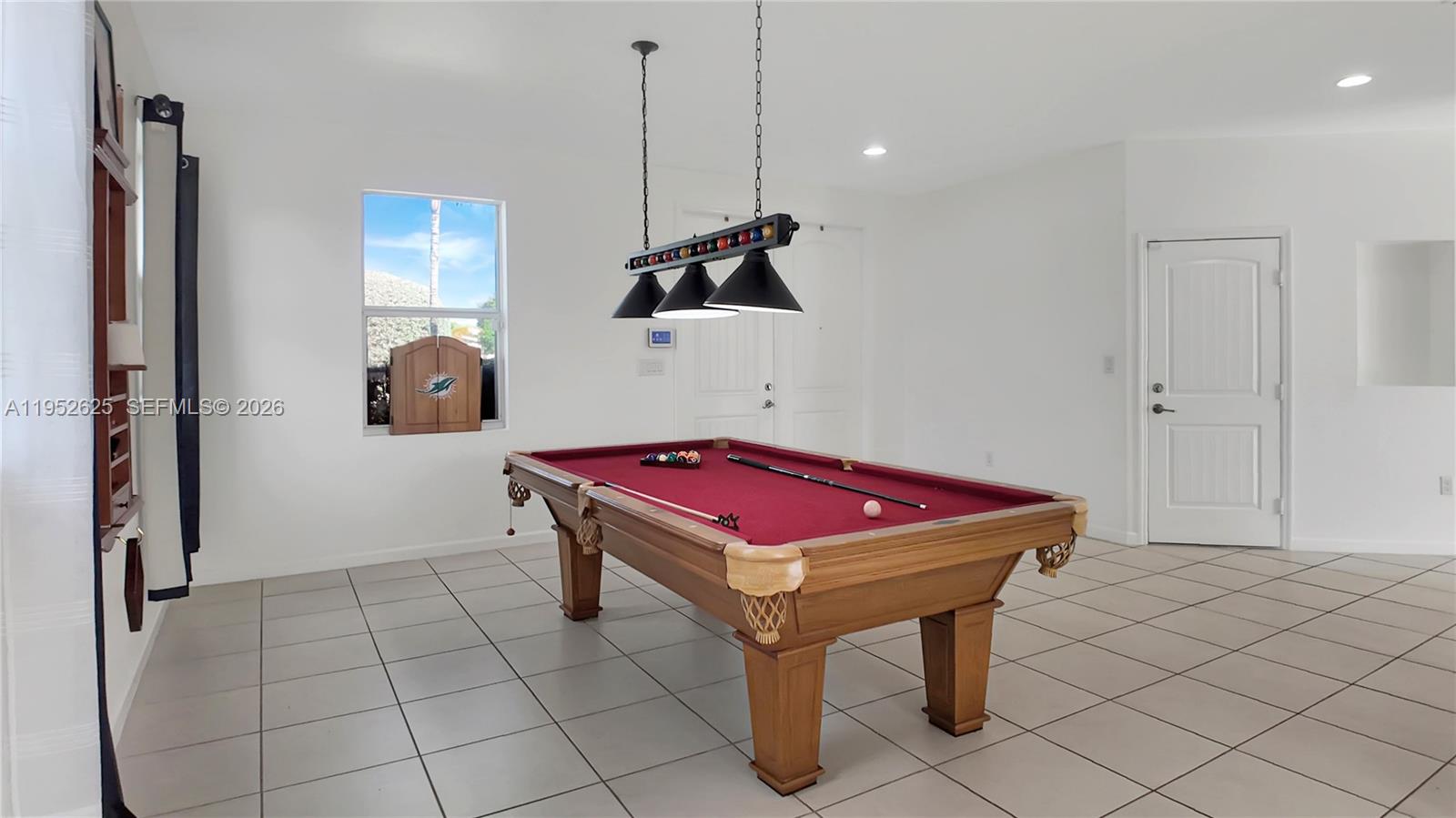 13160 Southwest 280th Street Homestead, FL 33033 - Photo 8 of 44 a room with pool table and a chandelier